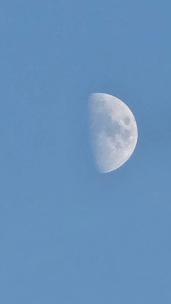 Kyiv skyline and moon at golden hour, July 2026