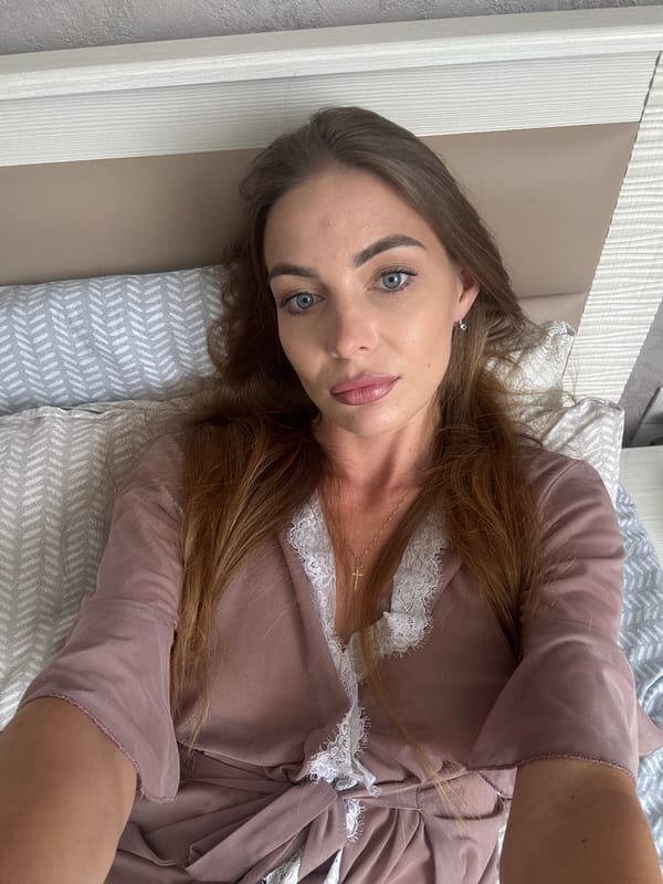 Relaxing in bed in Sochi, pink robe, morning mood
