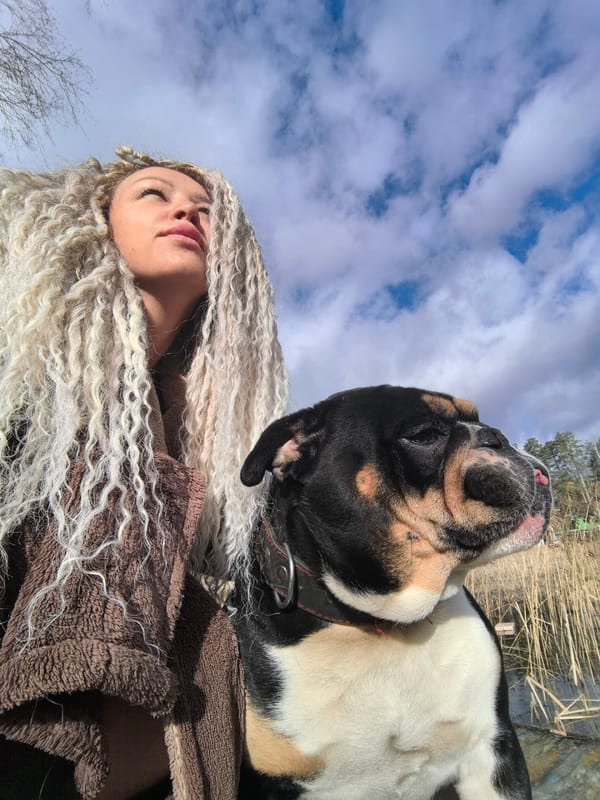 Woman and bulldog photographed during outdoor morning session in Russia