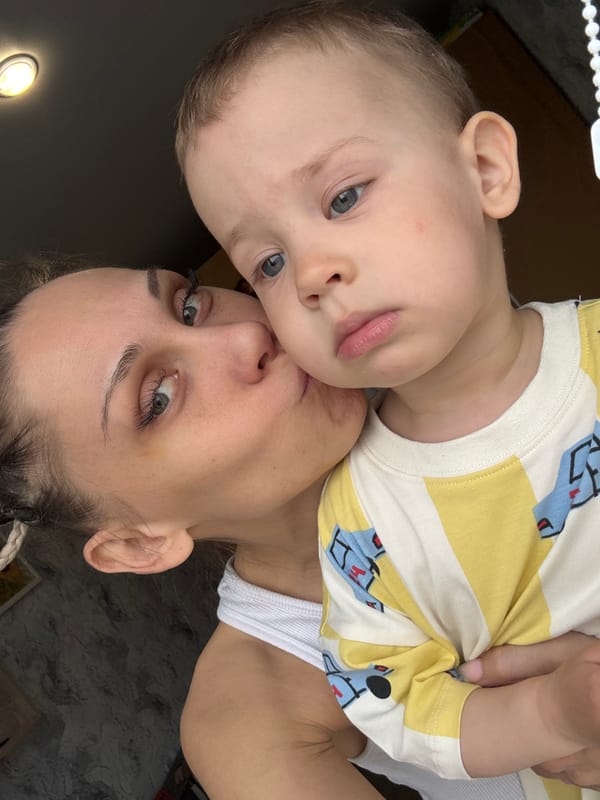 Mother and toddler share quiet morning moments in Rusanovo