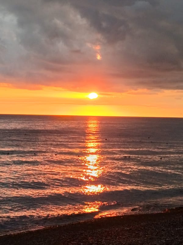 Golden hour on Sochi's pebble beach along the Black Sea