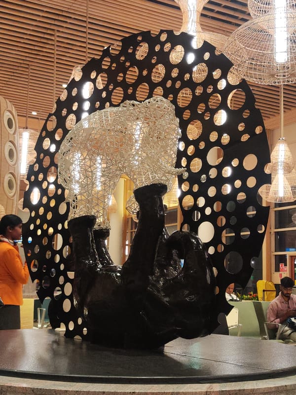 Black circular-cutout artwork photographed in Gangamuthanahalli, India