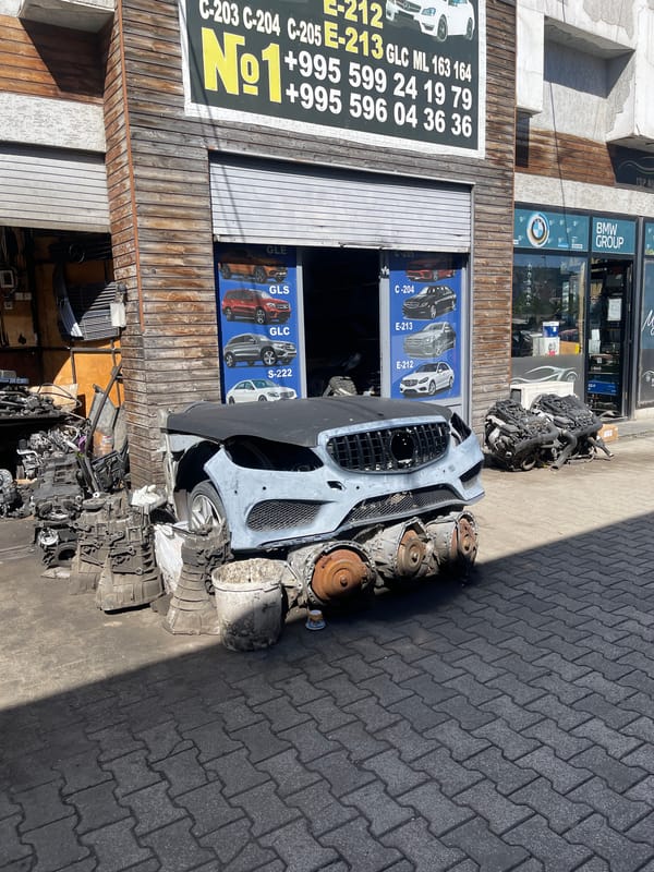 Auto salvage yard operations documented in Tbilisi, Georgia