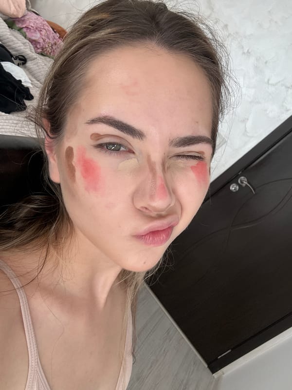 Woman applies makeup during beauty routine in Blagoevgrad residence
