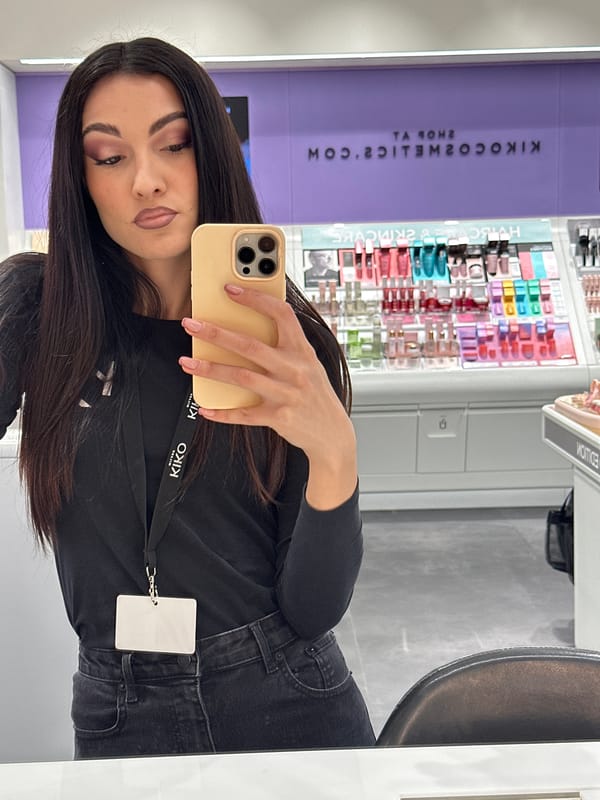 Woman Takes Mirror Selfies in Cosmetics Store