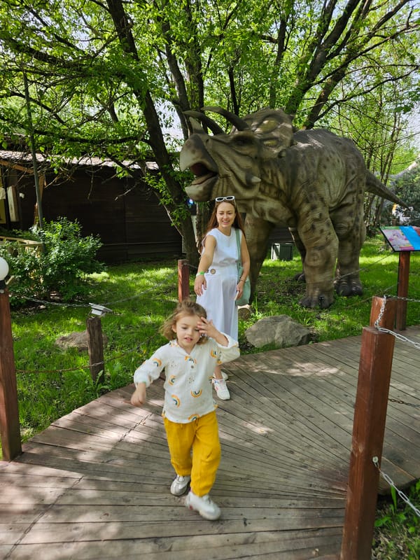 Family visits dinosaur park exhibit in Khimki, Russia