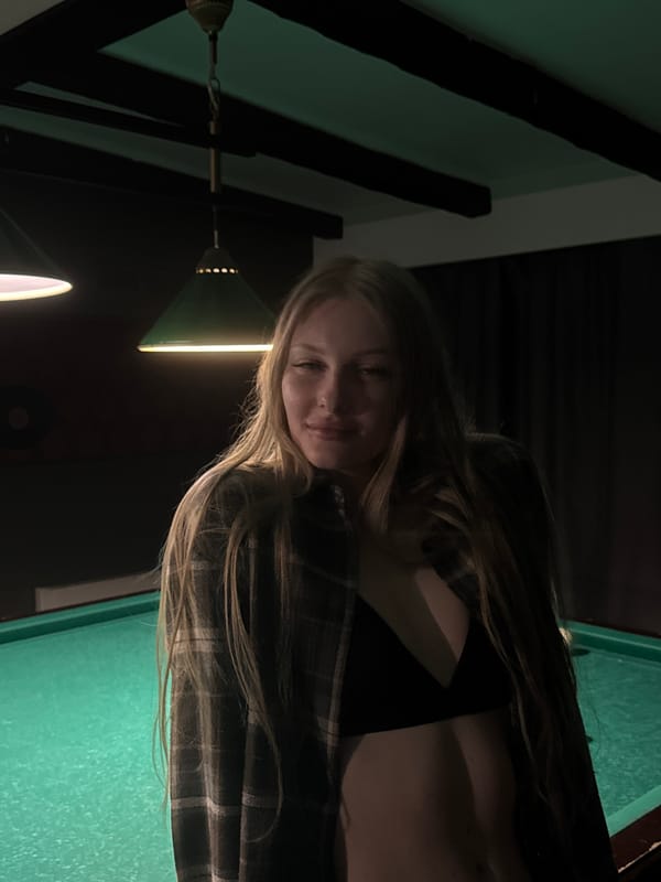 Friends socialize at billiards hall and pool in Perm
