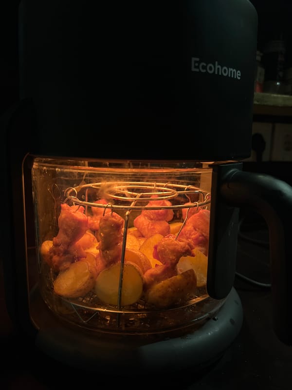 Home cooking session with cat companion in Sukawati