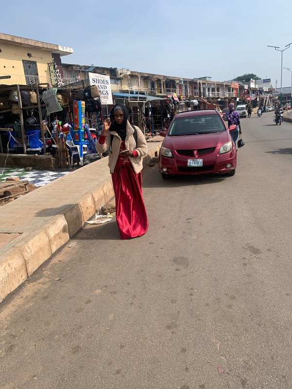 Morning street life and market activity in Jos, Nigeria
