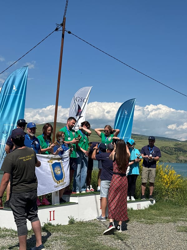 Outdoor awards ceremony celebrates winners with champagne on podium