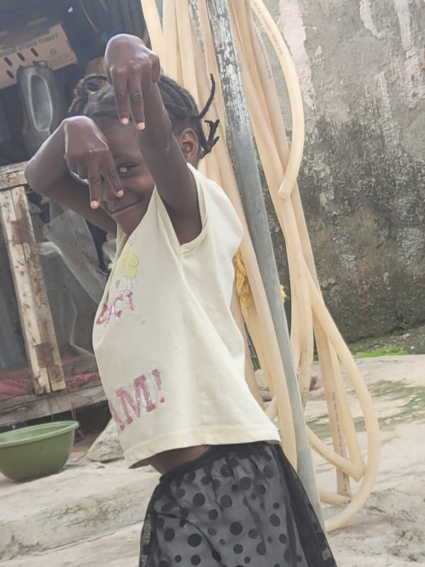 Daily life unfolds in Madalla: laundry, water, community