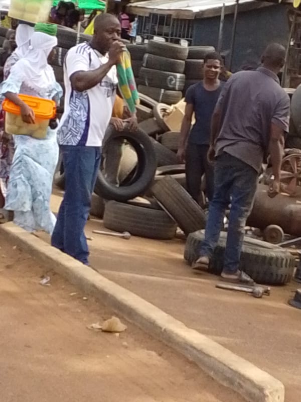 Two people spotted carrying containers in Tamale, Ghana