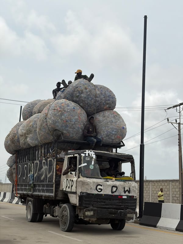 Truck hauling plastic bottles, horseback rider spotted in Nigeria
