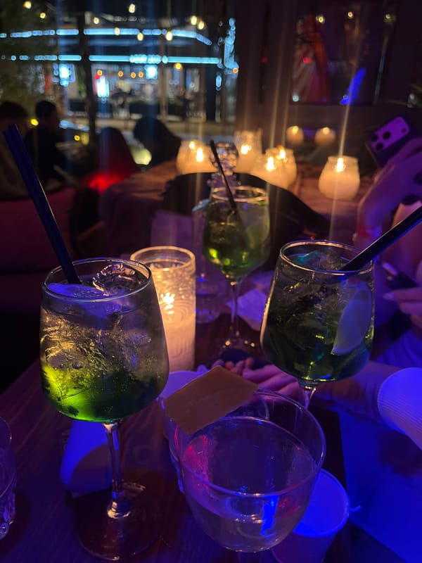 Evening social gathering at cave-themed bar in Kassandra, Greece