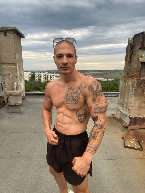 Rooftop moment above Pleven's apartment skyline