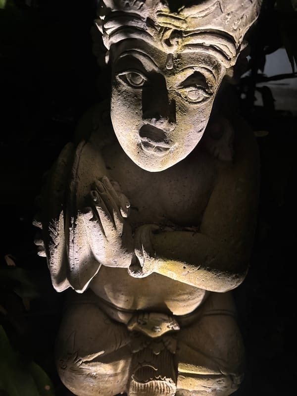 Tourist explores gardens and statues in Kuta Selatan across morning hours