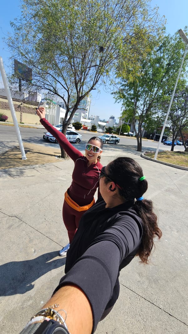 Women take selfie near Ferris wheel in Puebla