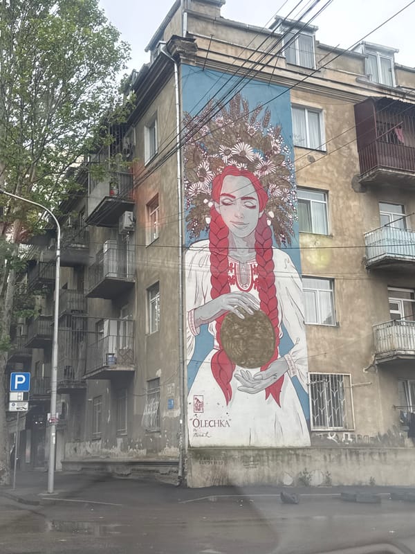 Mural of woman with red braids spotted on Tbilisi building