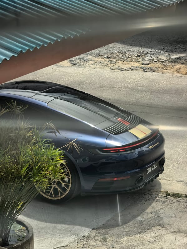 Hillside villas, palm-covered slopes, and a Porsche in Ko Samui