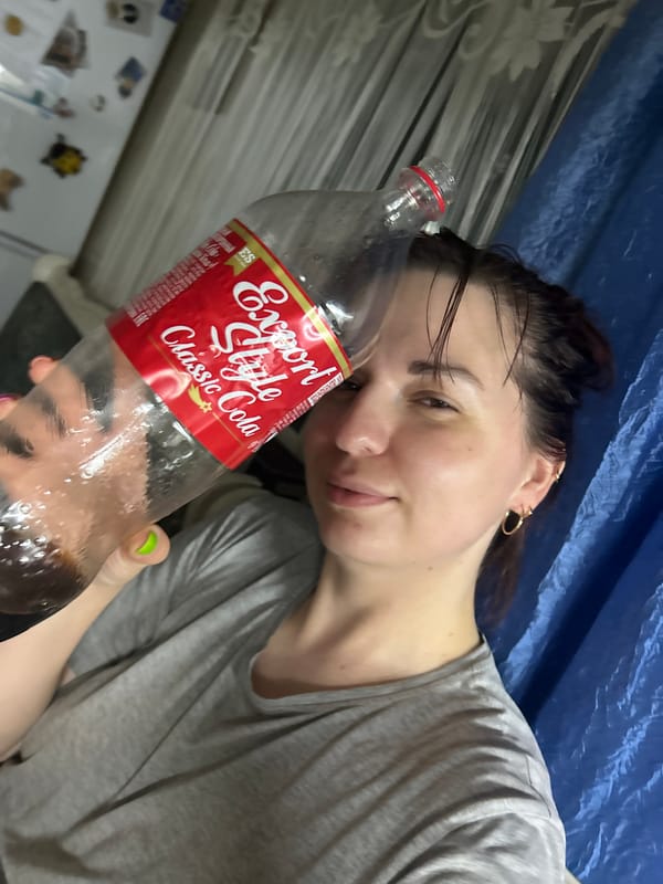 Messing around with a Cola bottle in Фоки, Russia