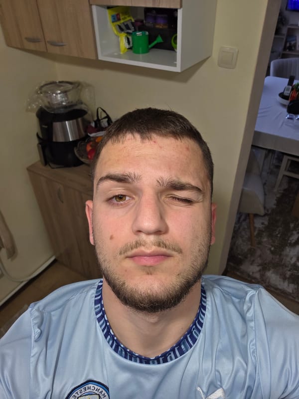 Man poses playfully in Manchester City jersey at Bulgarian home