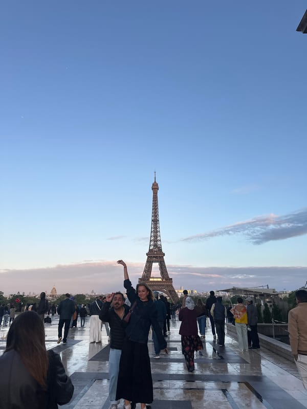 Tourists gather for photos at Eiffel Tower in Paris