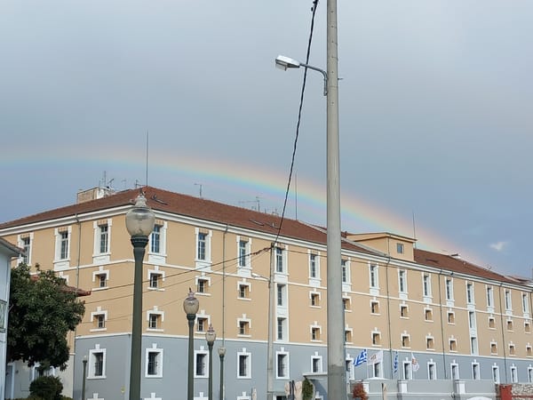 Rainbow appears over Drama, Greece as swans gather in park