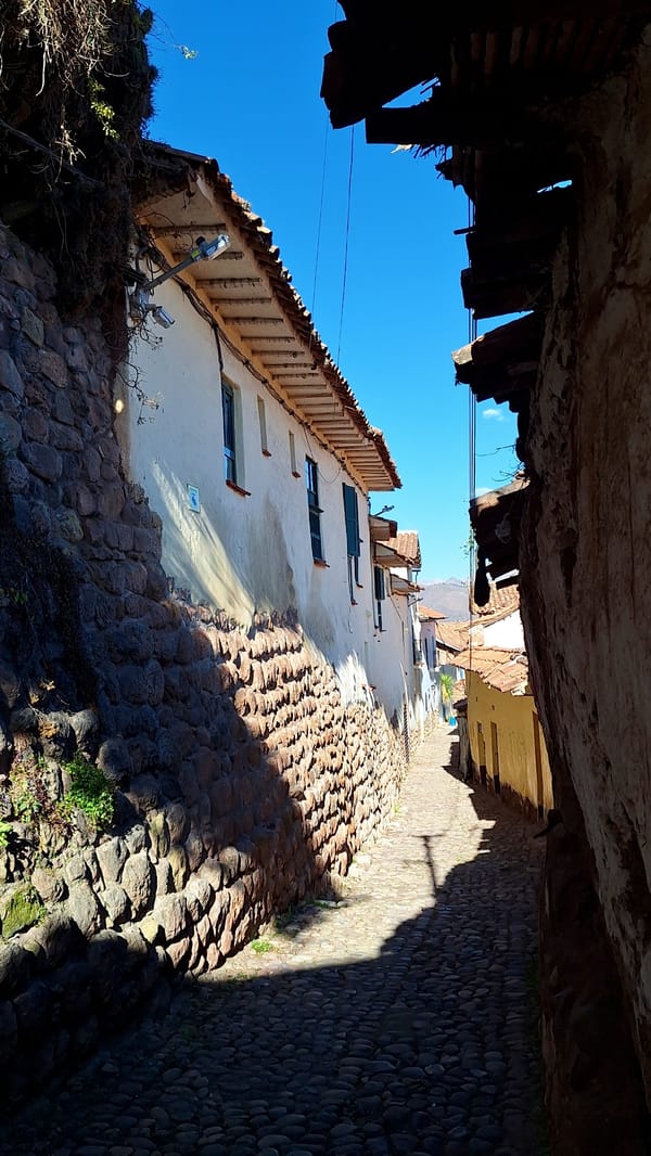 Up and down a cobblestone alley in Cuzco