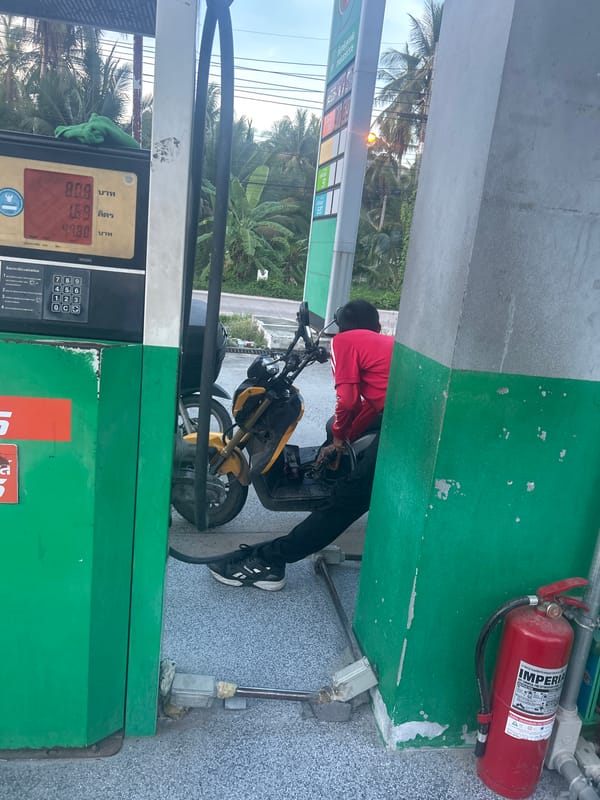 Person fills gas container at Koh Phangan station