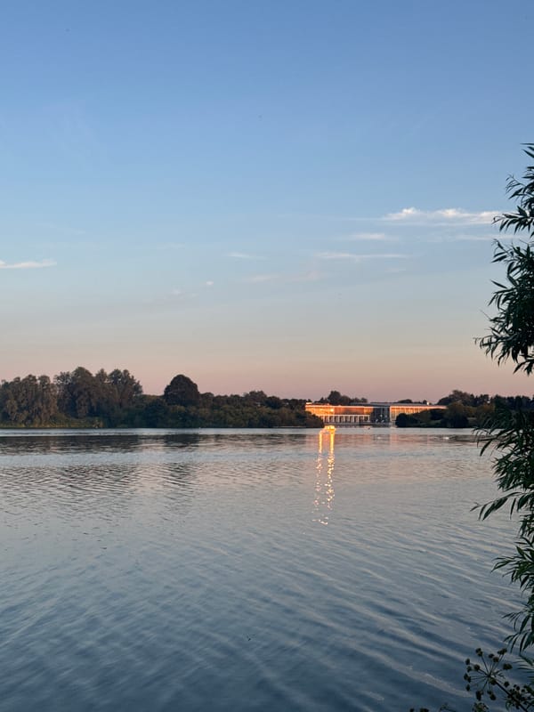 Sunset over Craigavon lake with modern glass building