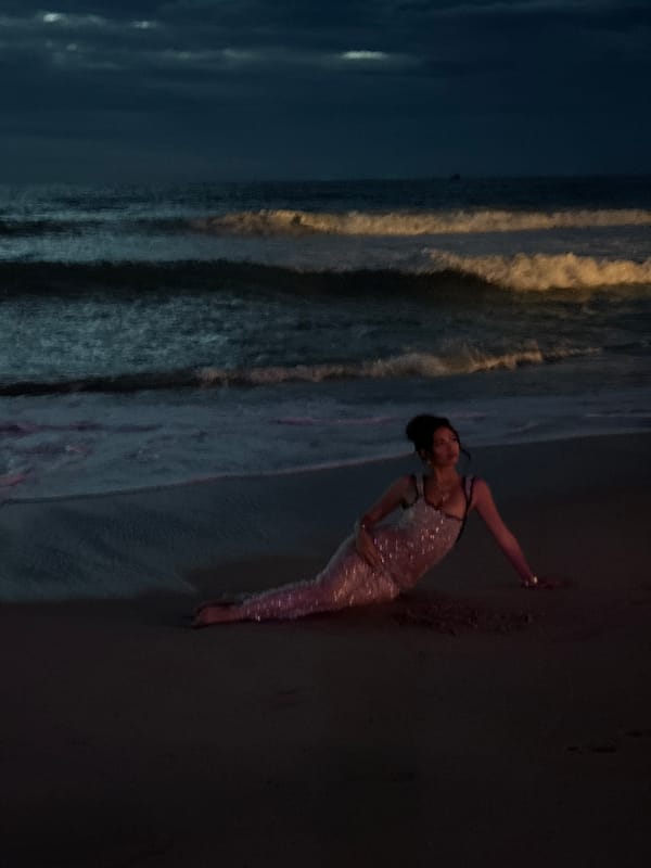 Fire performers spell 'NOMADA' at Thailand beach event