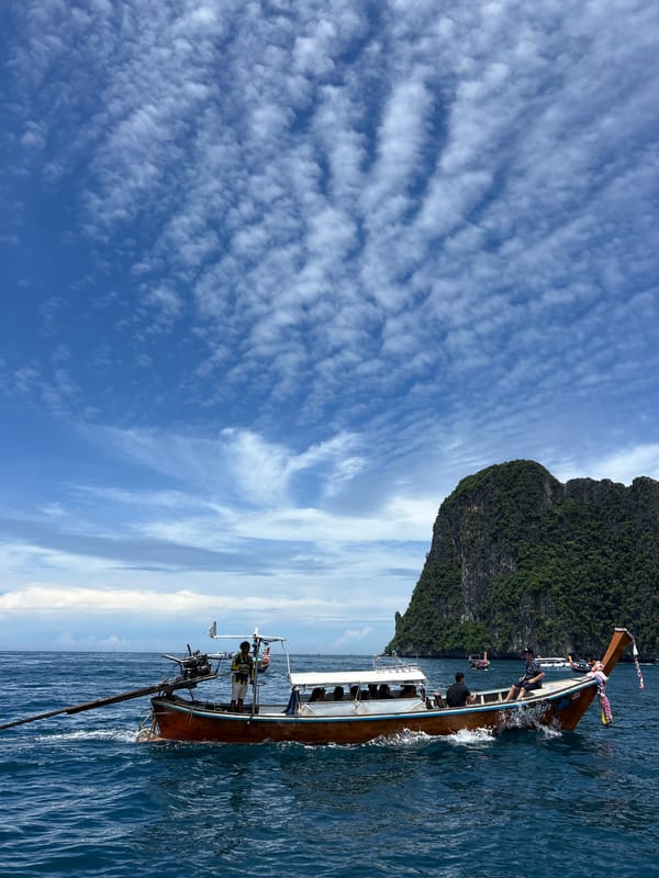 Longtail boat carries passengers through Ao Nang waters