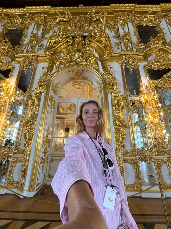 Tourists photograph ornate interiors at Catherine Palace in Russia