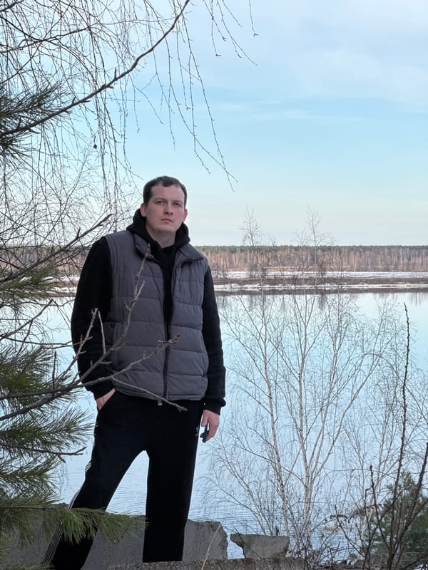 Man stands by partially frozen water in Chernushka