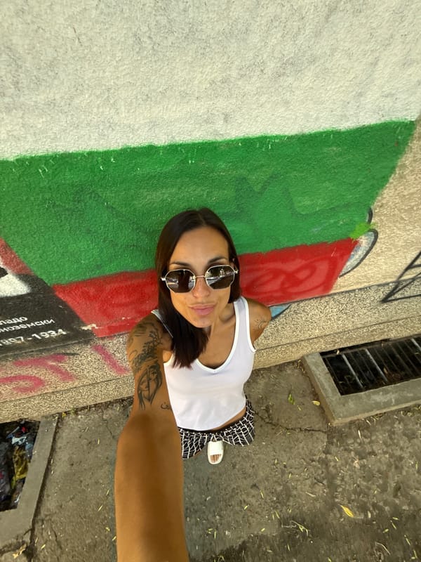 Selfie session around Pleven, Bulgaria near a flag mural
