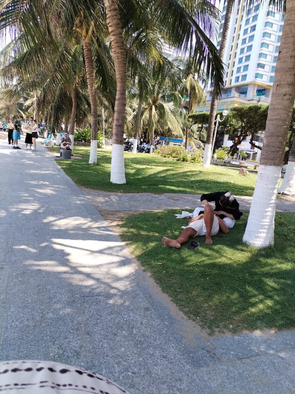 Couple rests near sculptured park in Nha Trang Ward