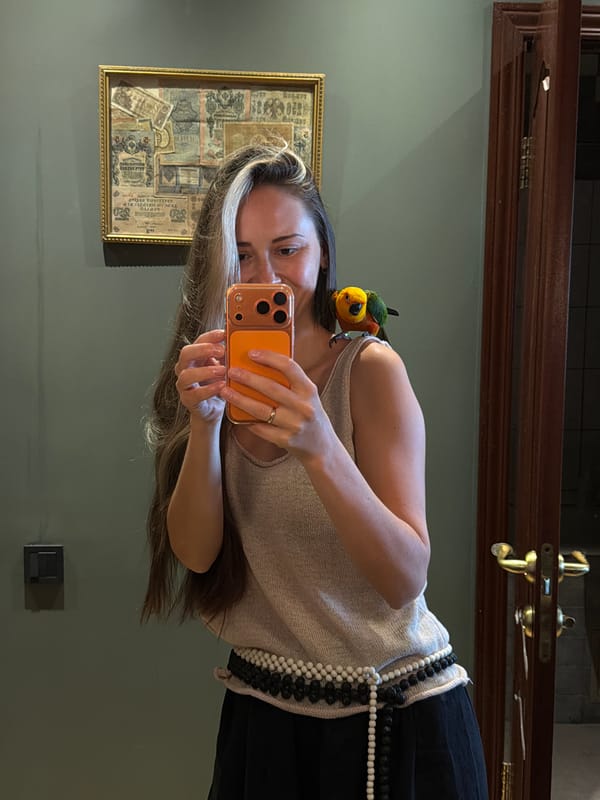 Woman and child share morning moments with pet parrot