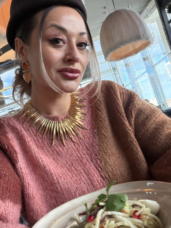 Woman enjoys tea and chocolate dessert at Krasnoyarsk cafe