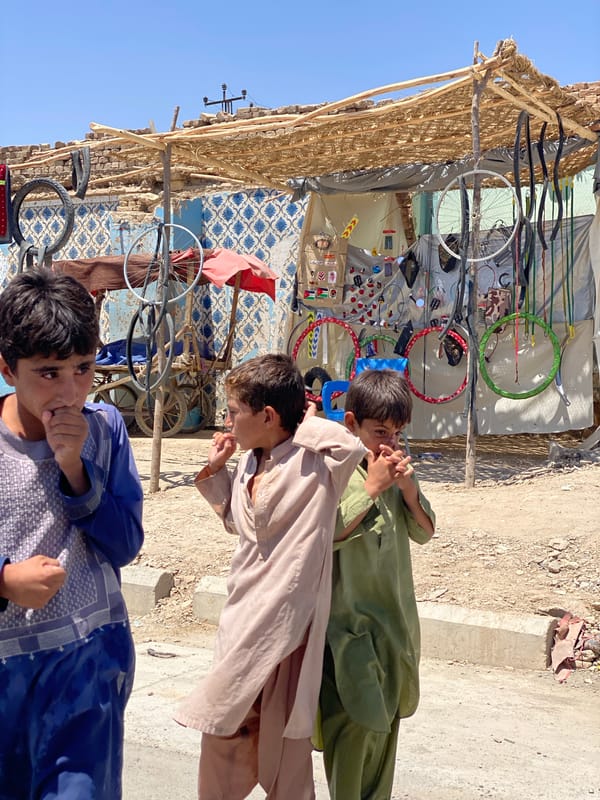 Street-level scenes from a Kandahar morning — markets, canals, stalls