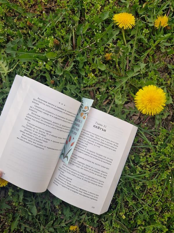 Open book spotted on dandelion-dotted grass in Sofia