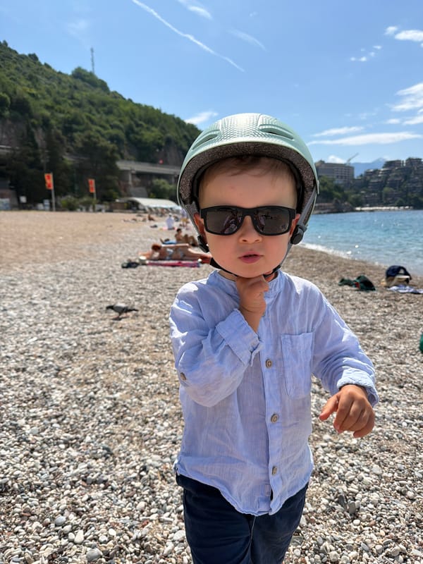 Child enjoys morning beach visit in Boreti, Montenegro