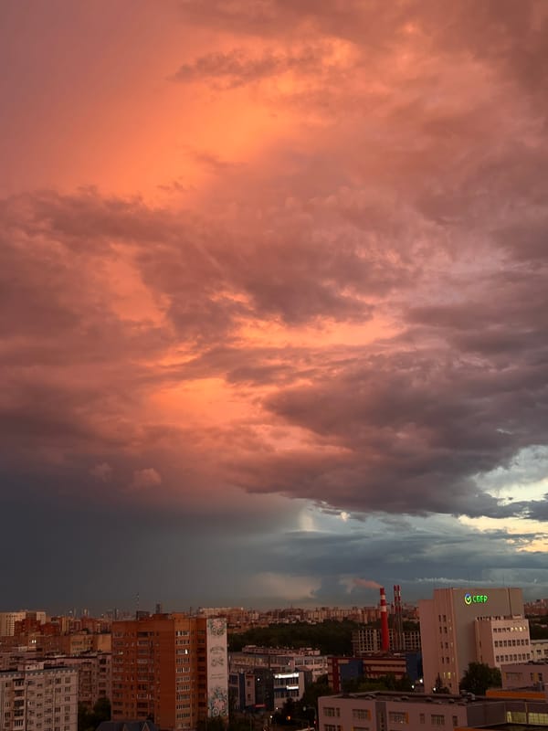 Sunset and rainbow over Mytishchi's residential skyline