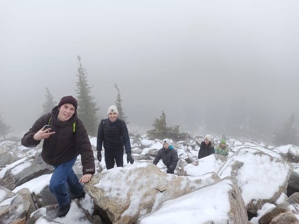 Hikers Navigate Foggy Snow-Covered Terrain Near Ziuratkul, Russia