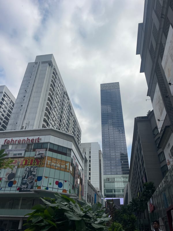 Street-level tour of Kuala Lumpur's commercial and skyline landmarks