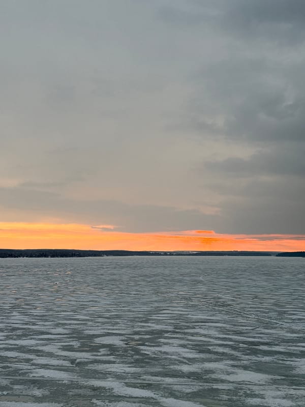 Sunset over frozen water captured in Votkinsk, Russia