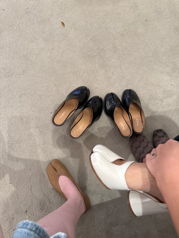 Maison Margiela Tabi shoe collection displayed on carpet in Miami