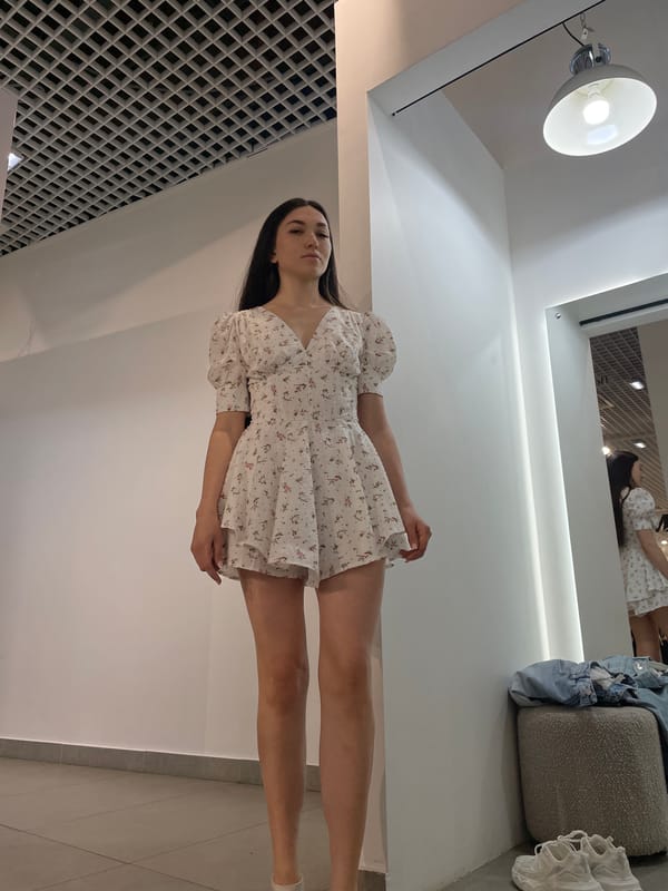 Woman tries on dresses while child plays in Kazan mall
