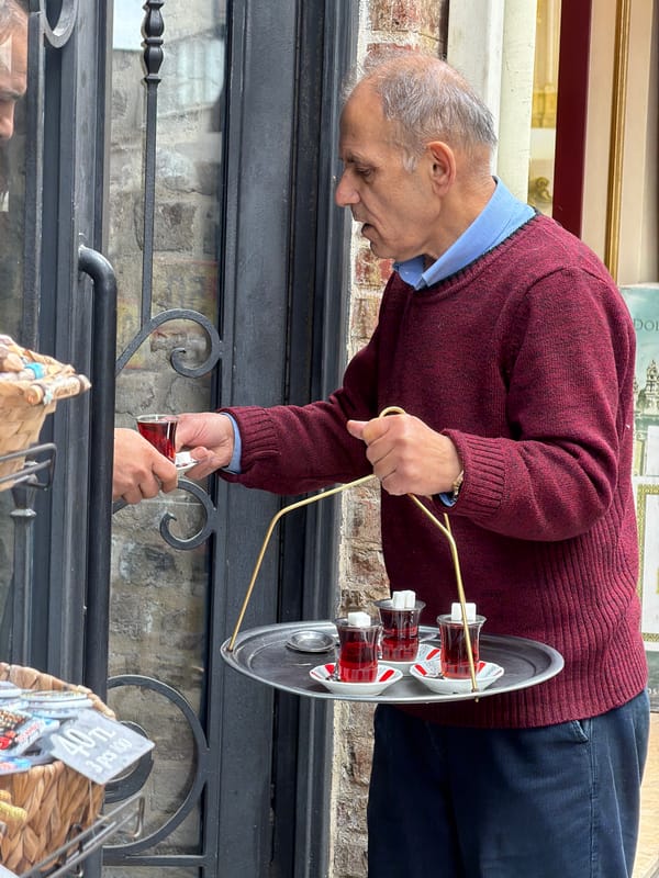 Vendor works at shop entrance in Istanbul's Beyoğlu district