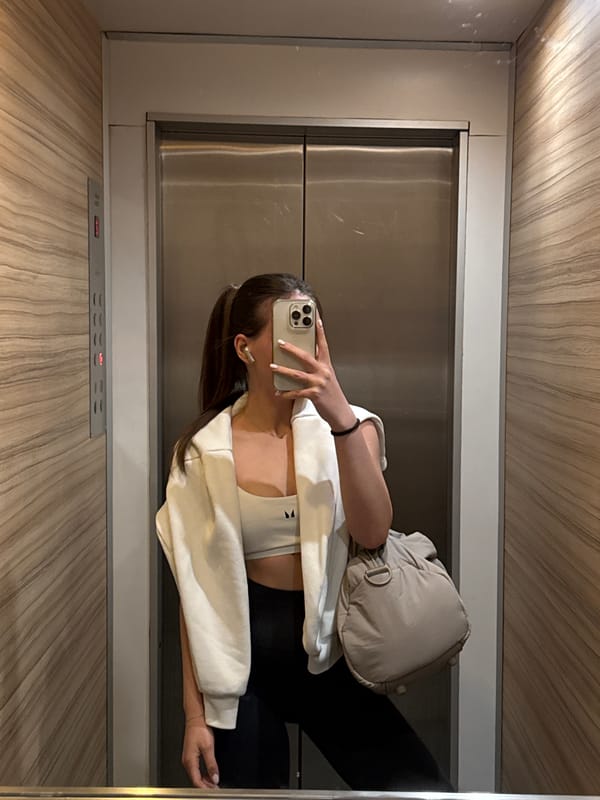 Person takes elevator selfie in athletic wear, Sofia