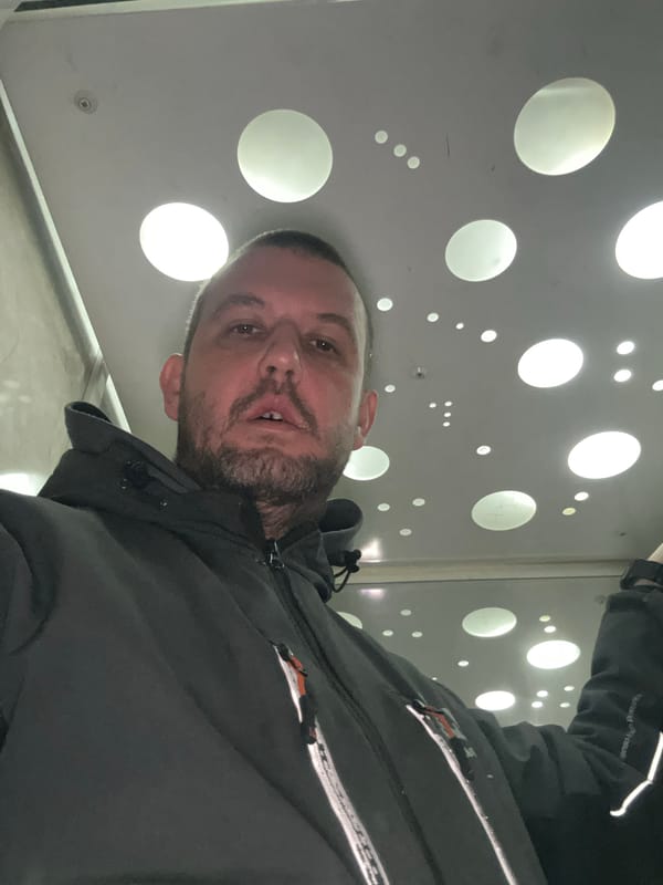 Man photographed against illuminated wall in Sofia